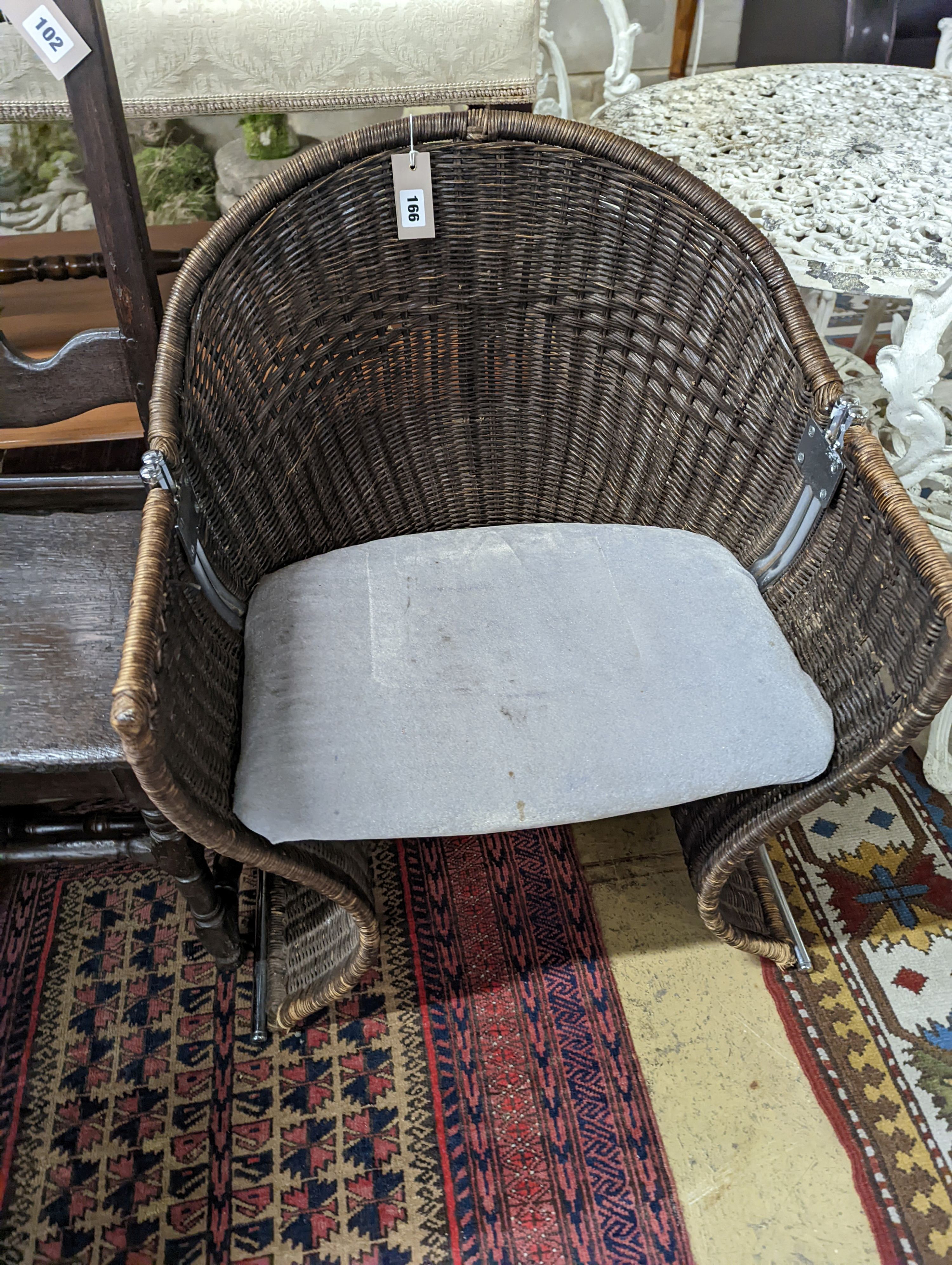A rattan and chrome conservatory chair, width 60cm, depth 50cm, height 73cm